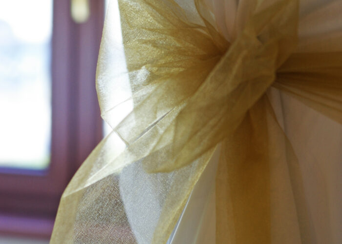 Xavin Hotel Harkány, szilveszteri rendezvény és csomagajánlat, székhuzat alkalomhoz illően, arany masnival