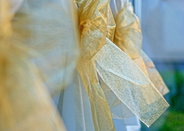 Xavin Hotel Harkány, szilveszteri rendezvény és csomagajánlat, székhuzat alkalomhoz illően, arany masnival